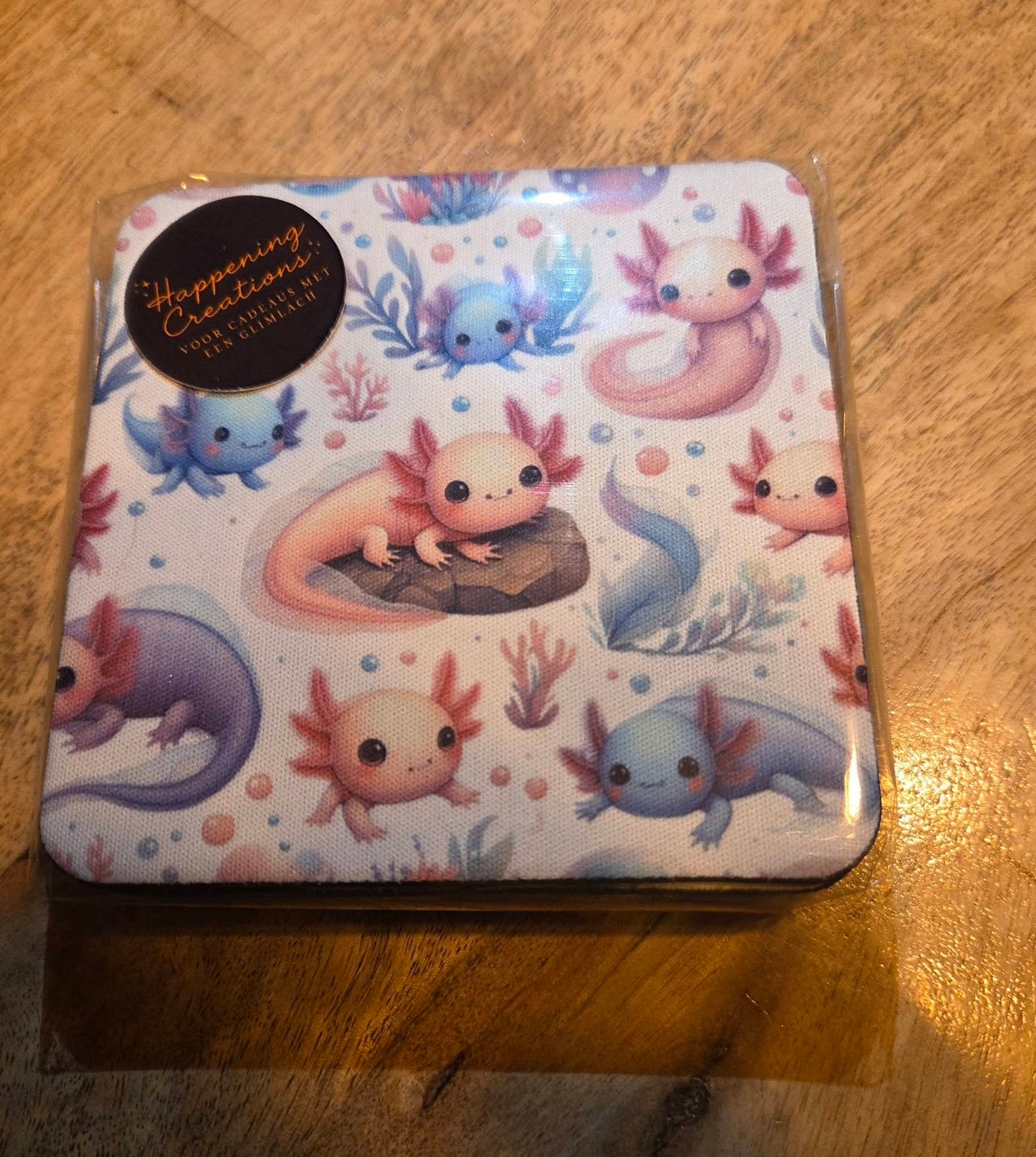 "Set van 4 bedrukte rubberen axolotl onderzetters in pastelkleuren"