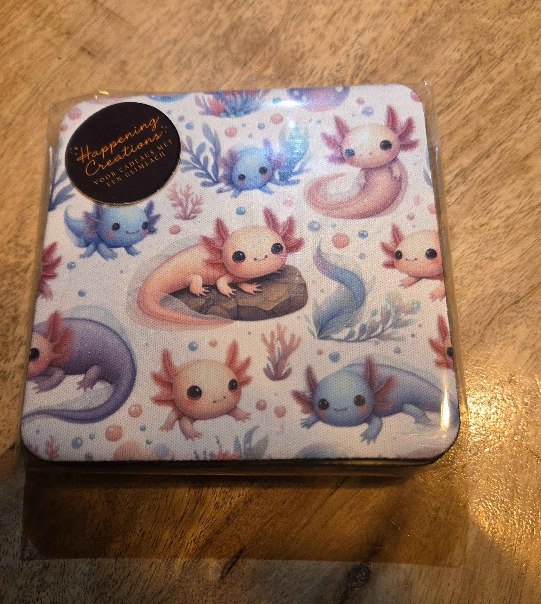 "Set van 4 bedrukte rubberen axolotl onderzetters in pastelkleuren"